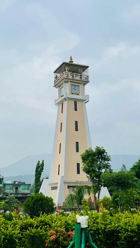 the tall tower structure has a clock displayed on it