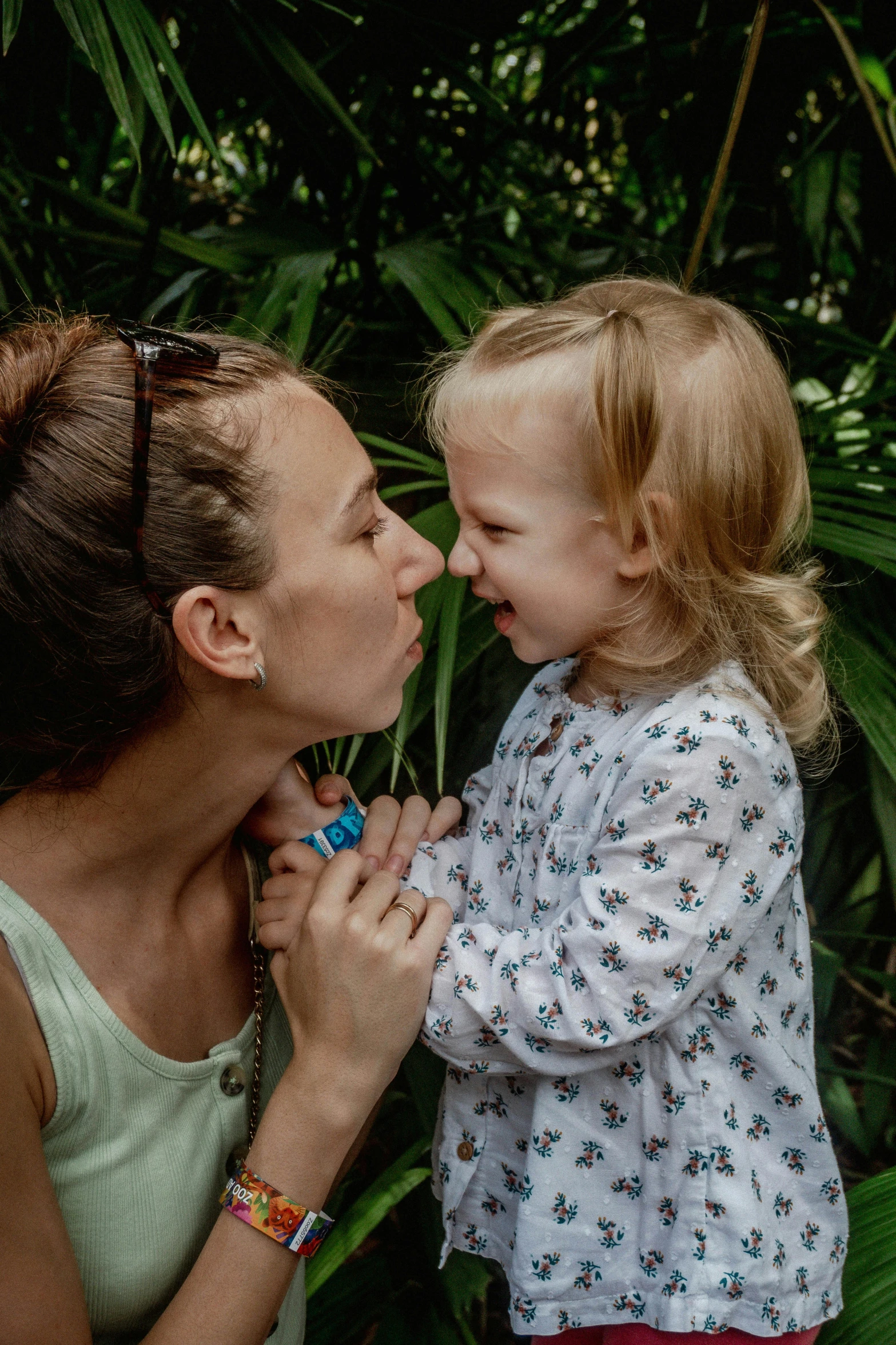 the mother with her baby girl is licking her lips