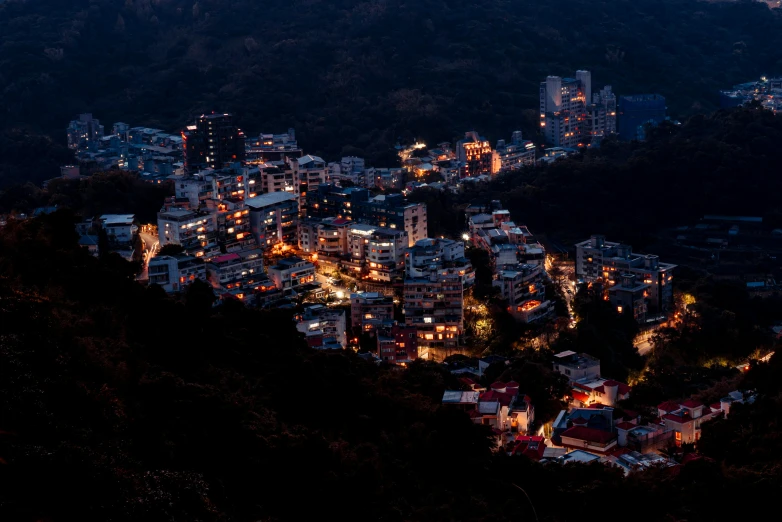 some buildings and lights on a hill side