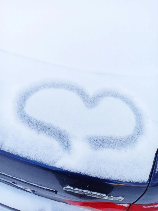 the rear of a car with snow on it