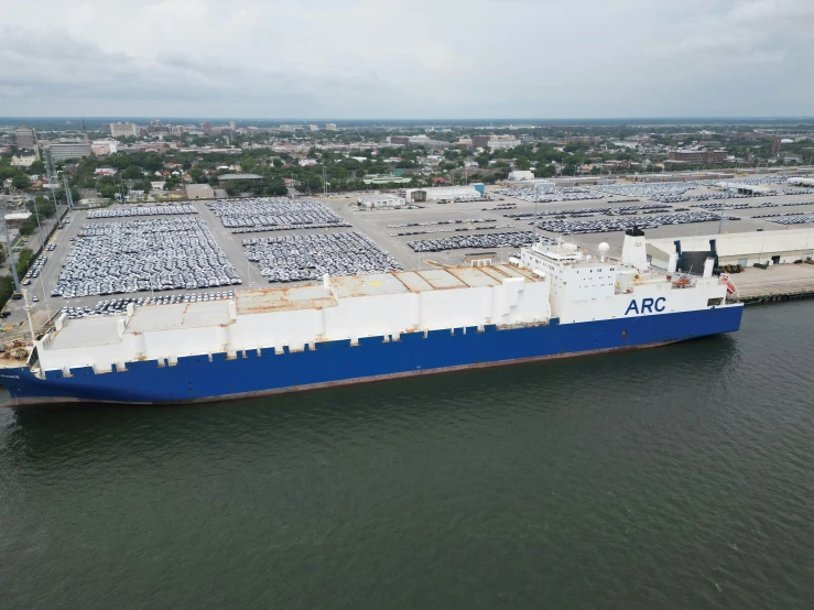 a large ship parked at the dock in a harbor