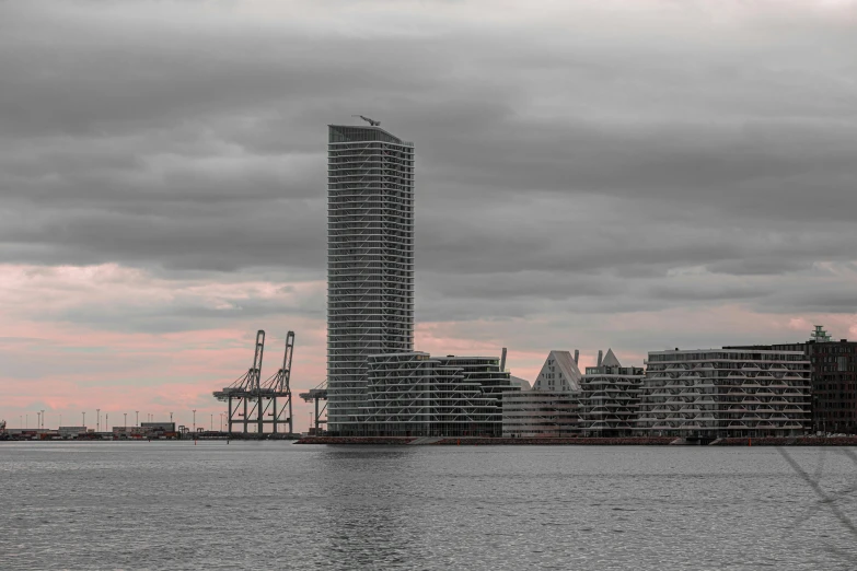 an ocean with water and city scape in the background