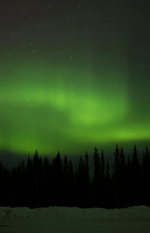 a large green and black display of the aurora or northern sky