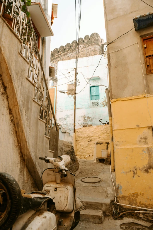 a scooter parked in front of some buildings