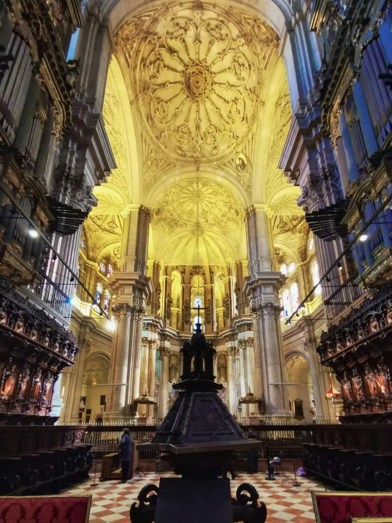 the inside of an old cathedral with a fancy pew