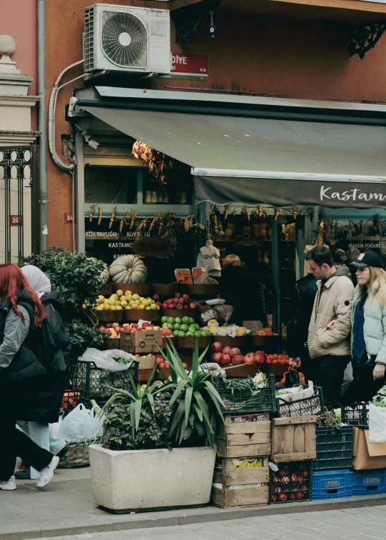 a market with many fruits and vegetables in front of it