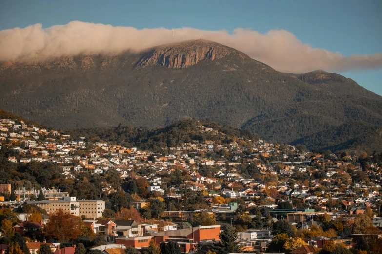 a view of a city with mountains in the background