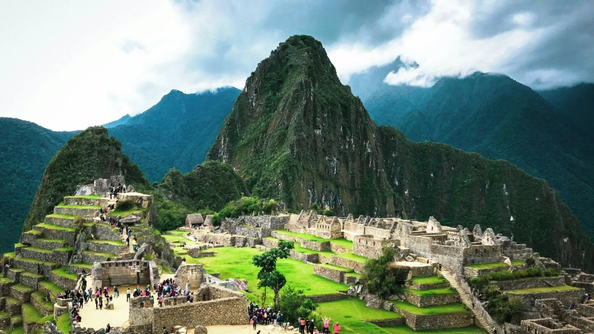 people walking in the wilderness with many ancient ruins