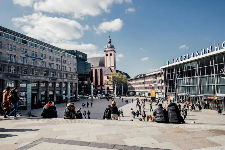 a city square with many people standing around