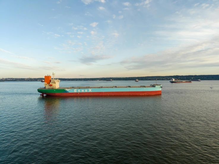 a large ship sailing in the ocean during a sunny day