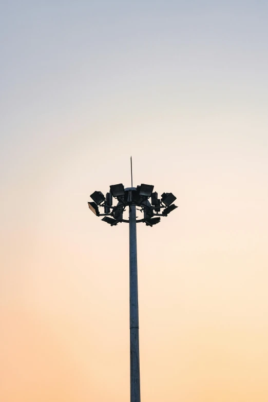 a light pole against a clear blue sky
