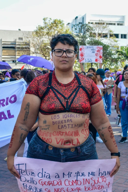 there is a woman that is holding a sign