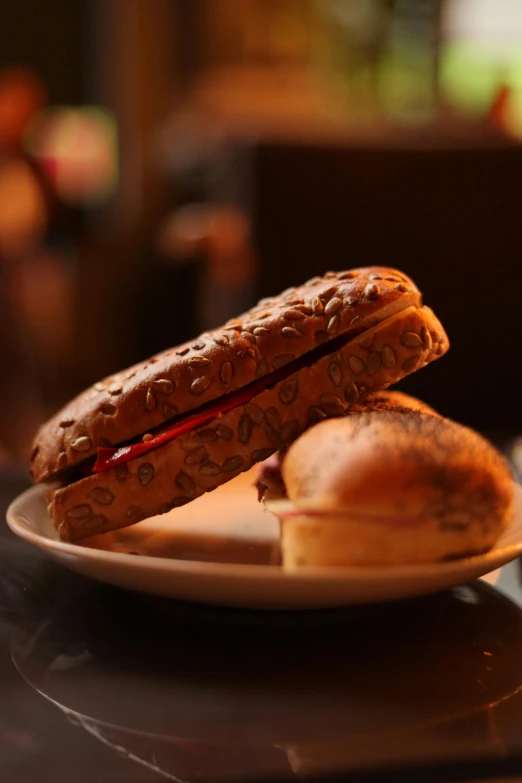 a plate with two sandwich halves on it