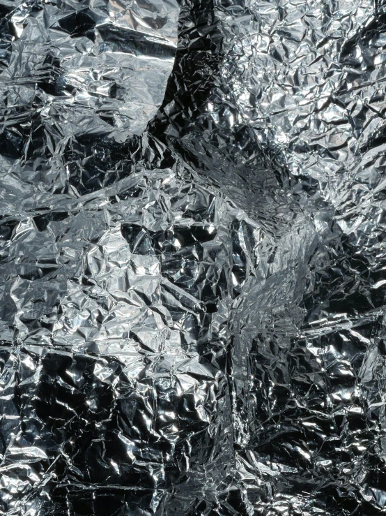 a close up of aluminum foil on top of a table