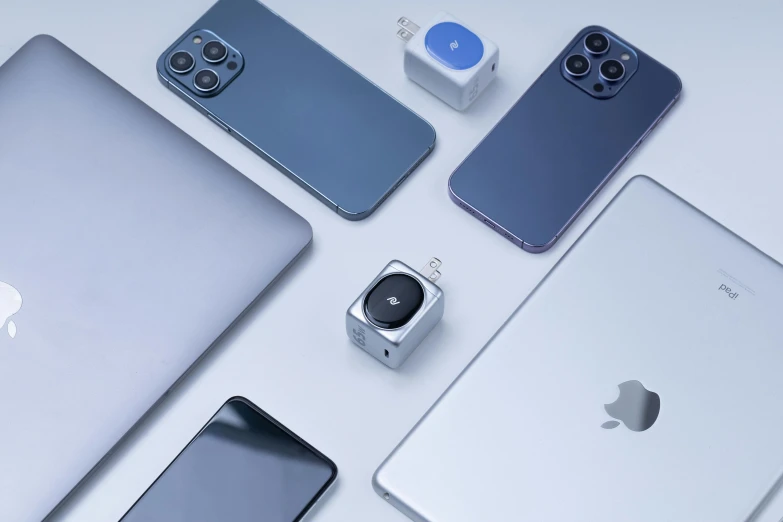 four apple products are displayed on a table