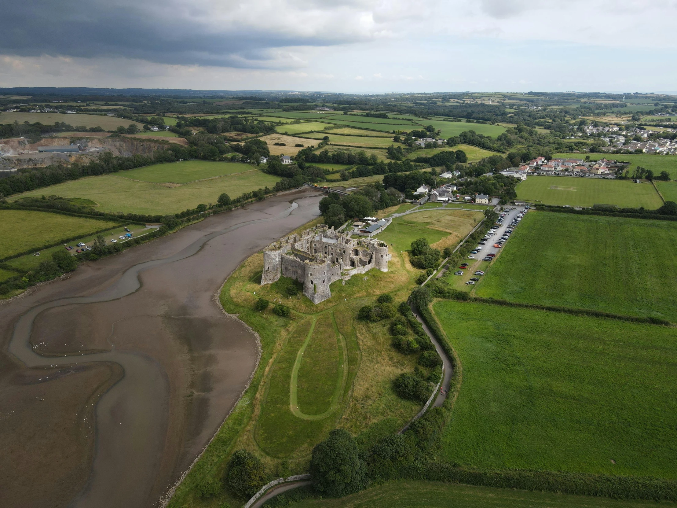 an aerial view of a castle and field area