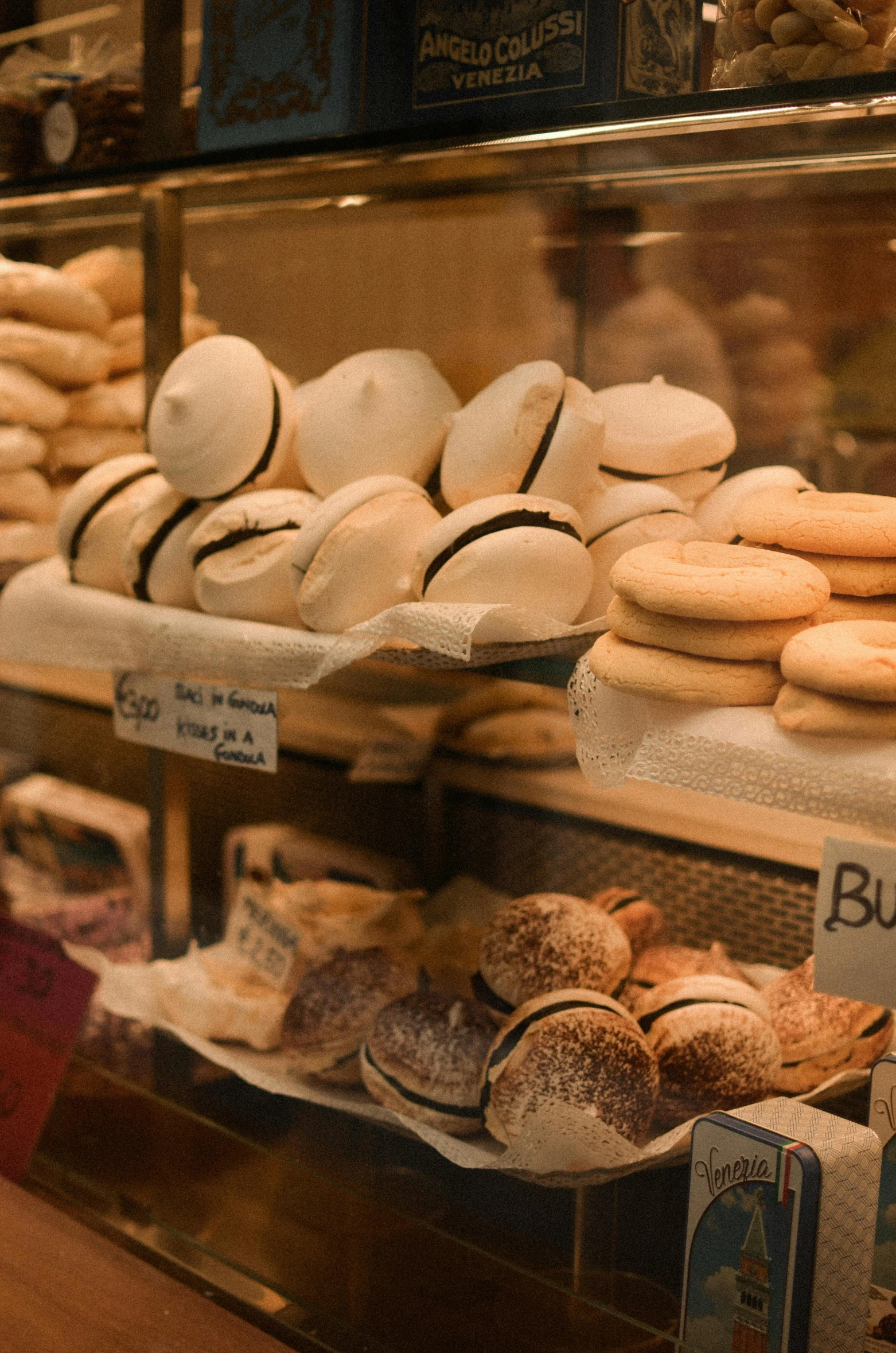 an assortment of baked goods displayed in the shop