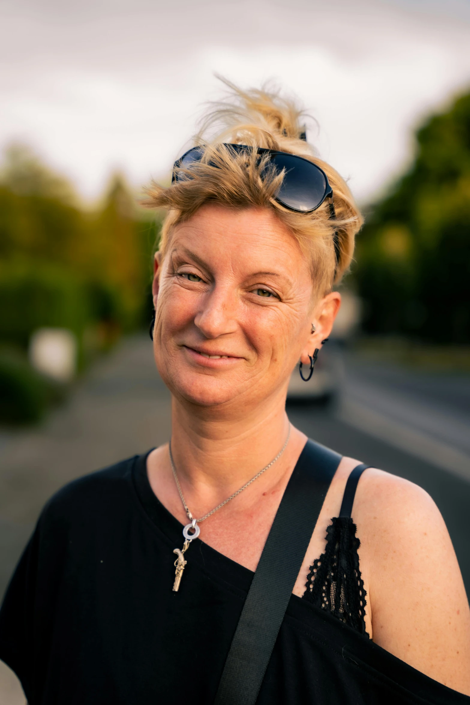 a woman in sunglasses posing for a po