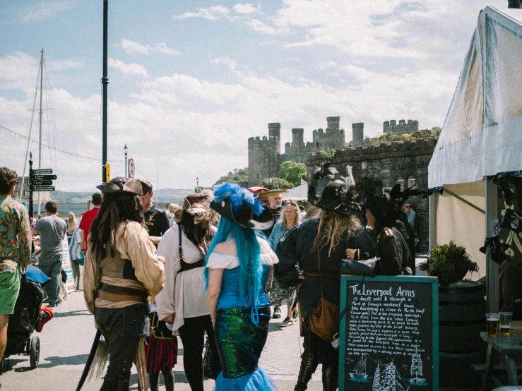 group of people at a small outdoor flea market