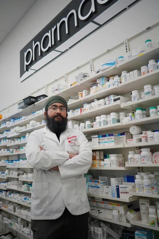 a man stands in front of shelves of different products in a pharmacy