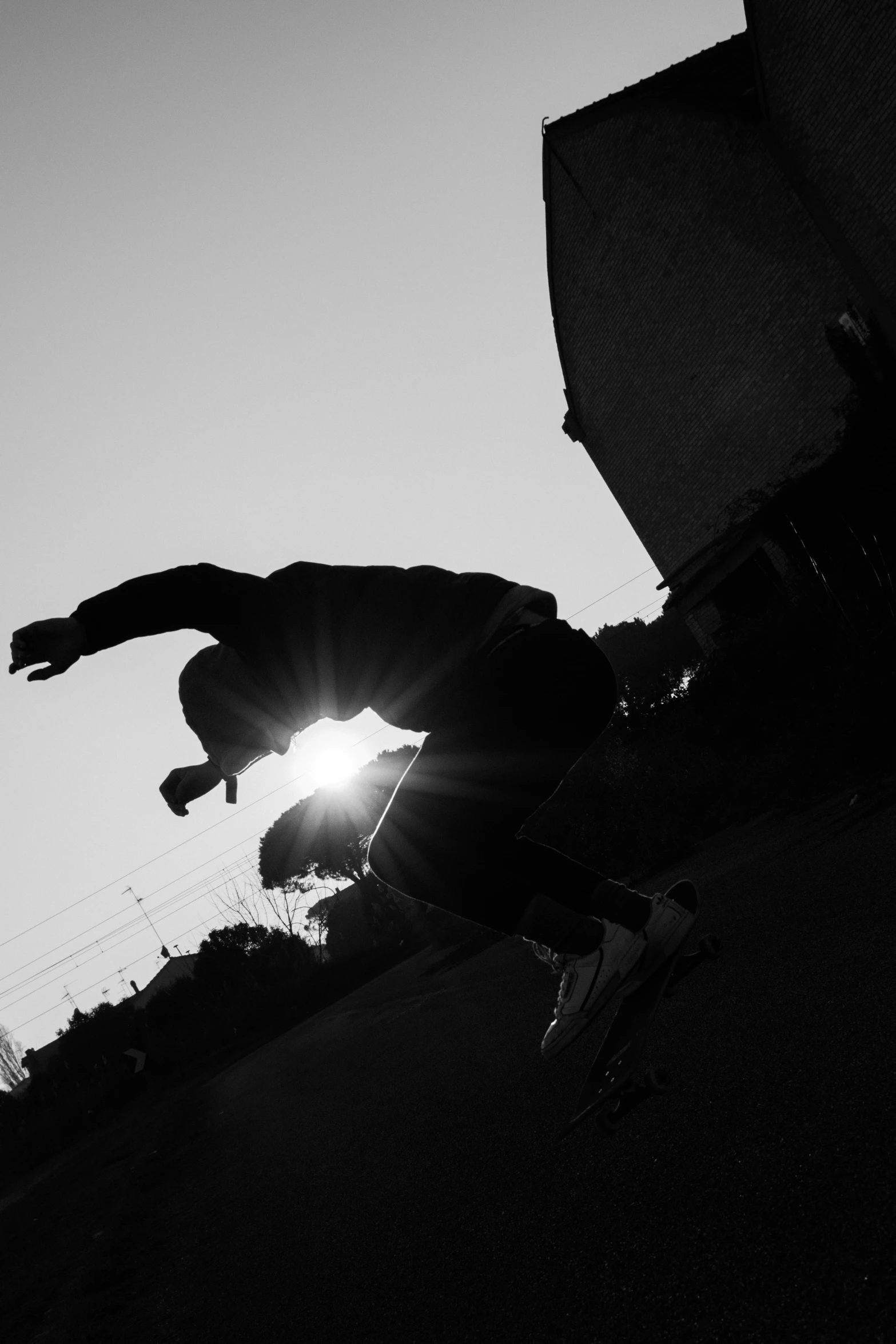 a person jumping in the air with a skateboard