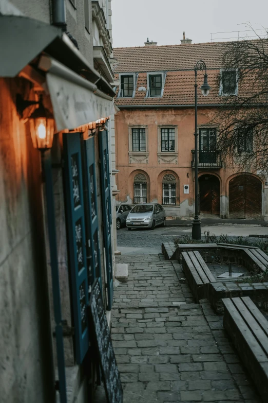 the light is on outside of a brick building