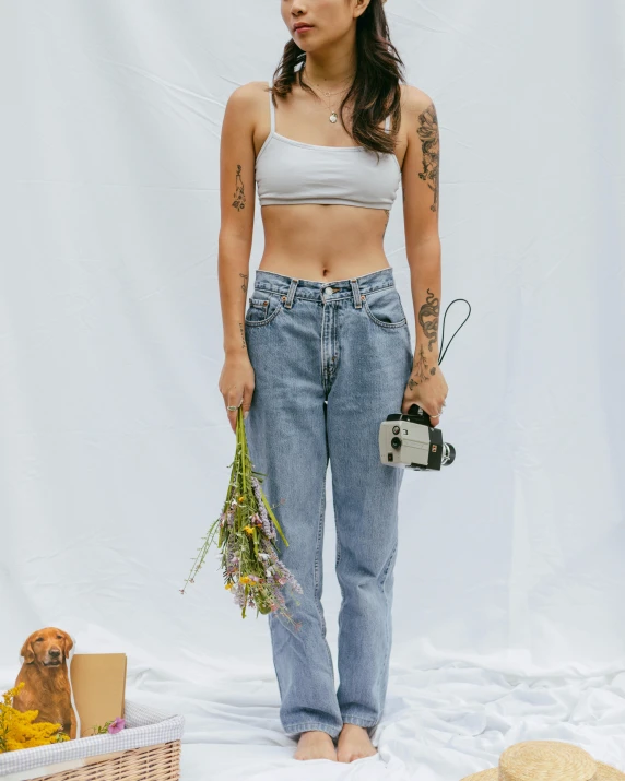 a woman is standing on a white sheet