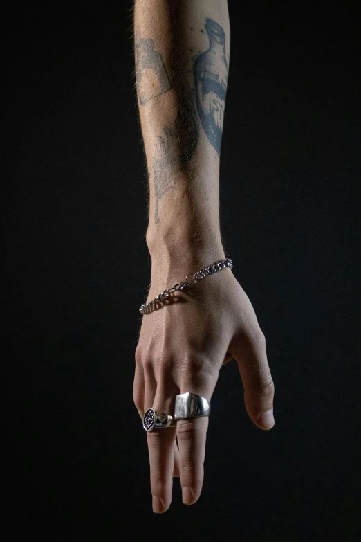 a man with tattoos and tattoos on his arm