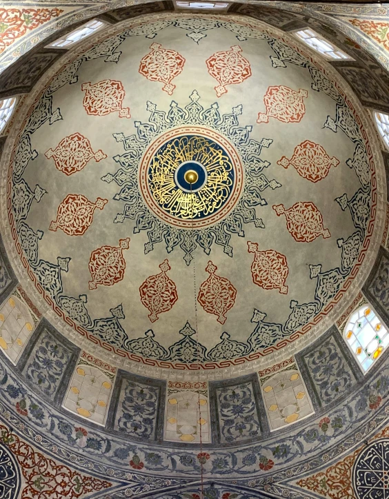 ornate architecture and stained glasswork in an ornate dome