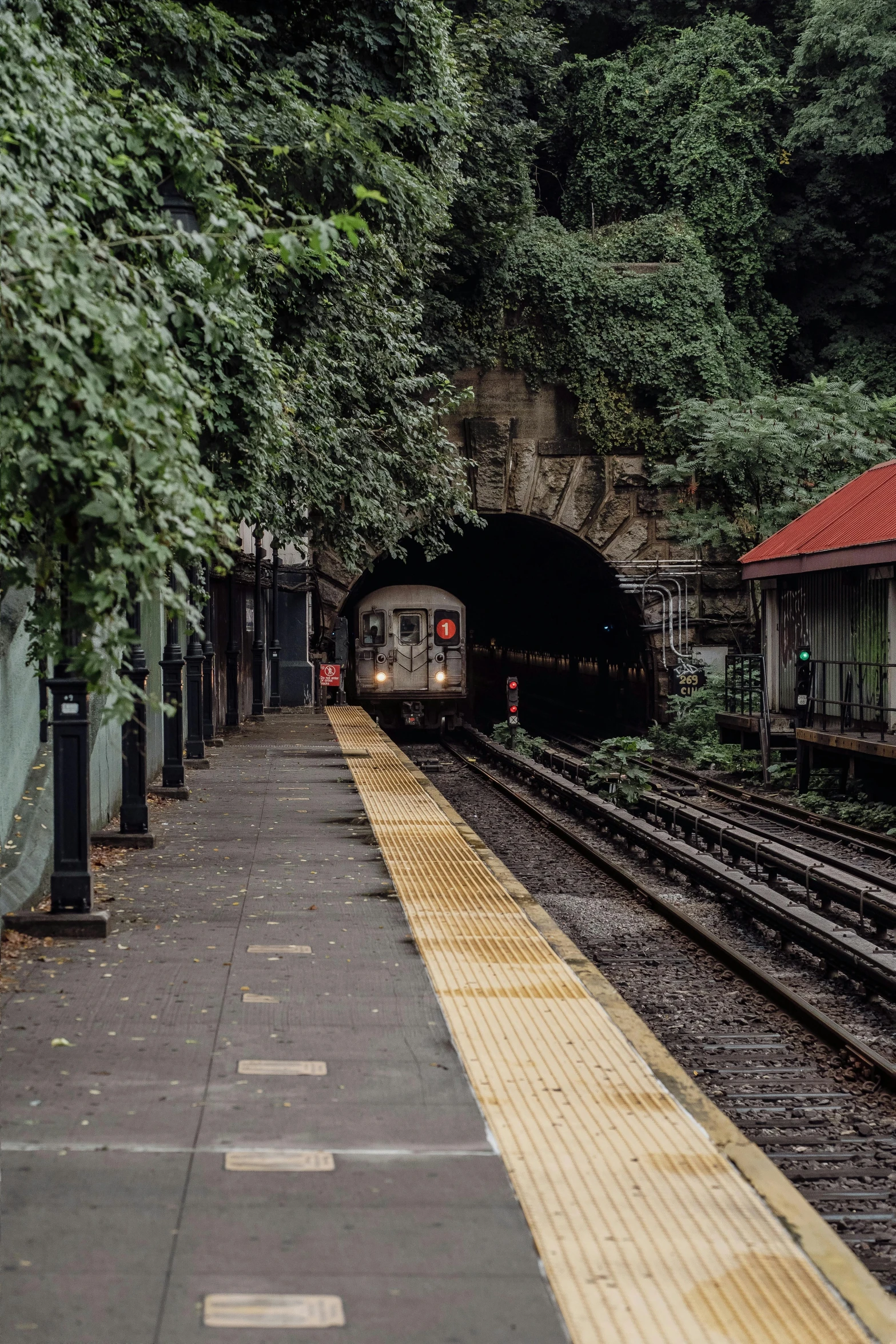 a train is coming out of a tunnel