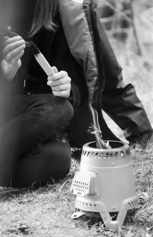 a woman holding a bird with her beak