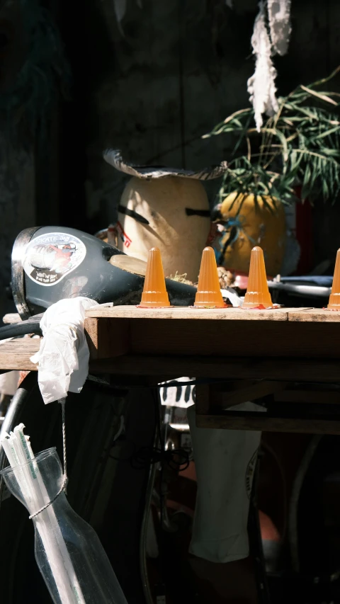 the cones are lined up on a small wooden tray