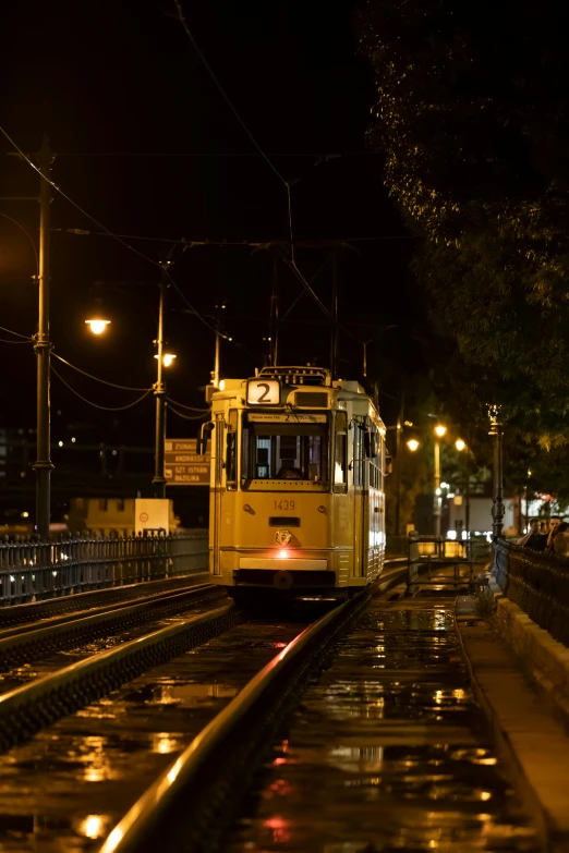a public transit train stopped at night time