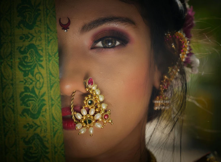 a woman with large earrings on her head