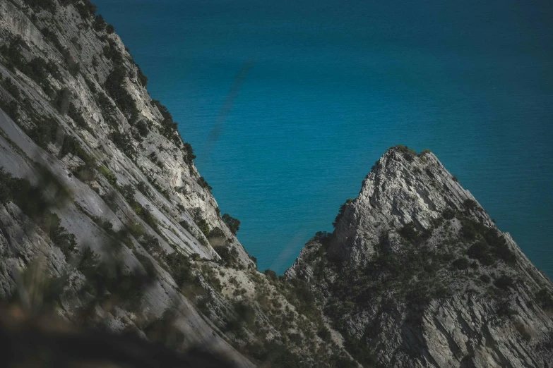 some very pretty mountains by the ocean and sky