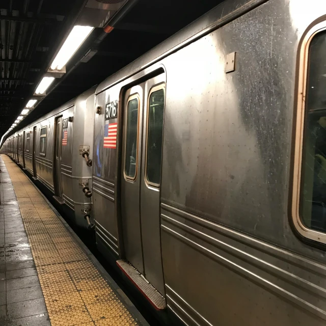 a train stopped at the platform for passengers