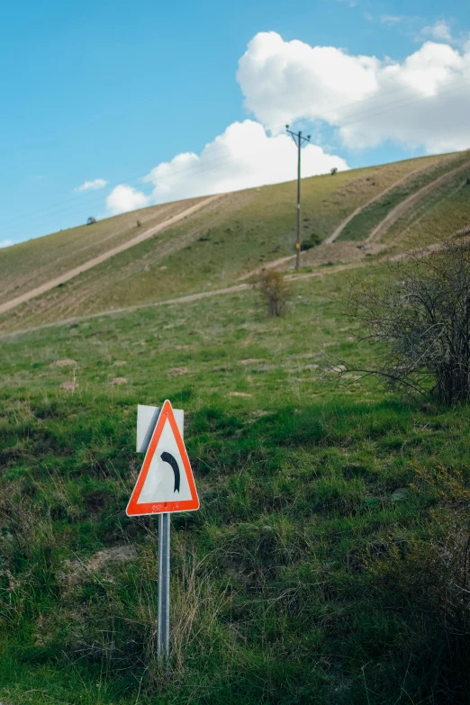 a sign on the side of the road warns people that they may fall or be thrown off