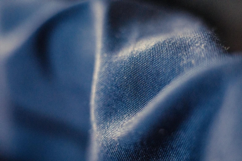 blue and white cloth with a black background