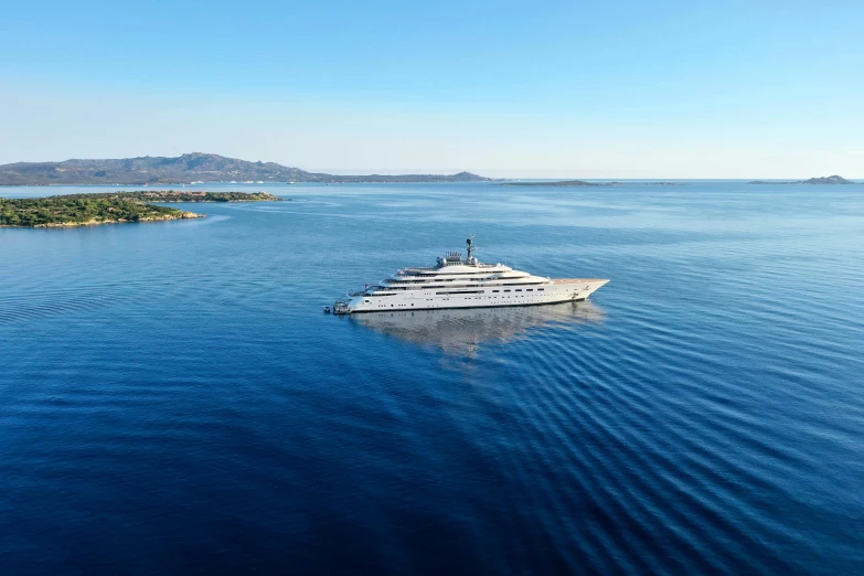 a yacht on the water with a clear sky