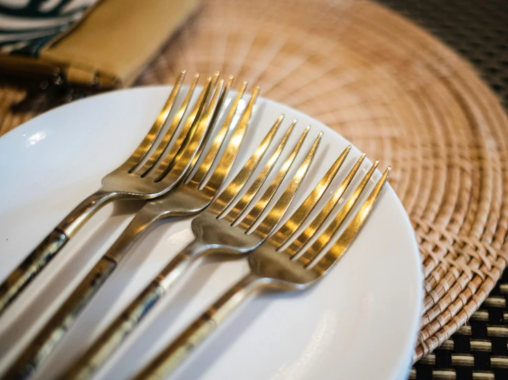 an assortment of silverware is served on a white plate