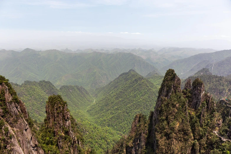 a valley with a mountain range in the distance