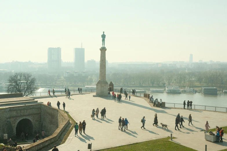 a group of people walking around a park