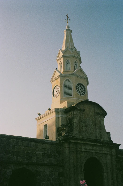 a tall clock tower with a clock at the top