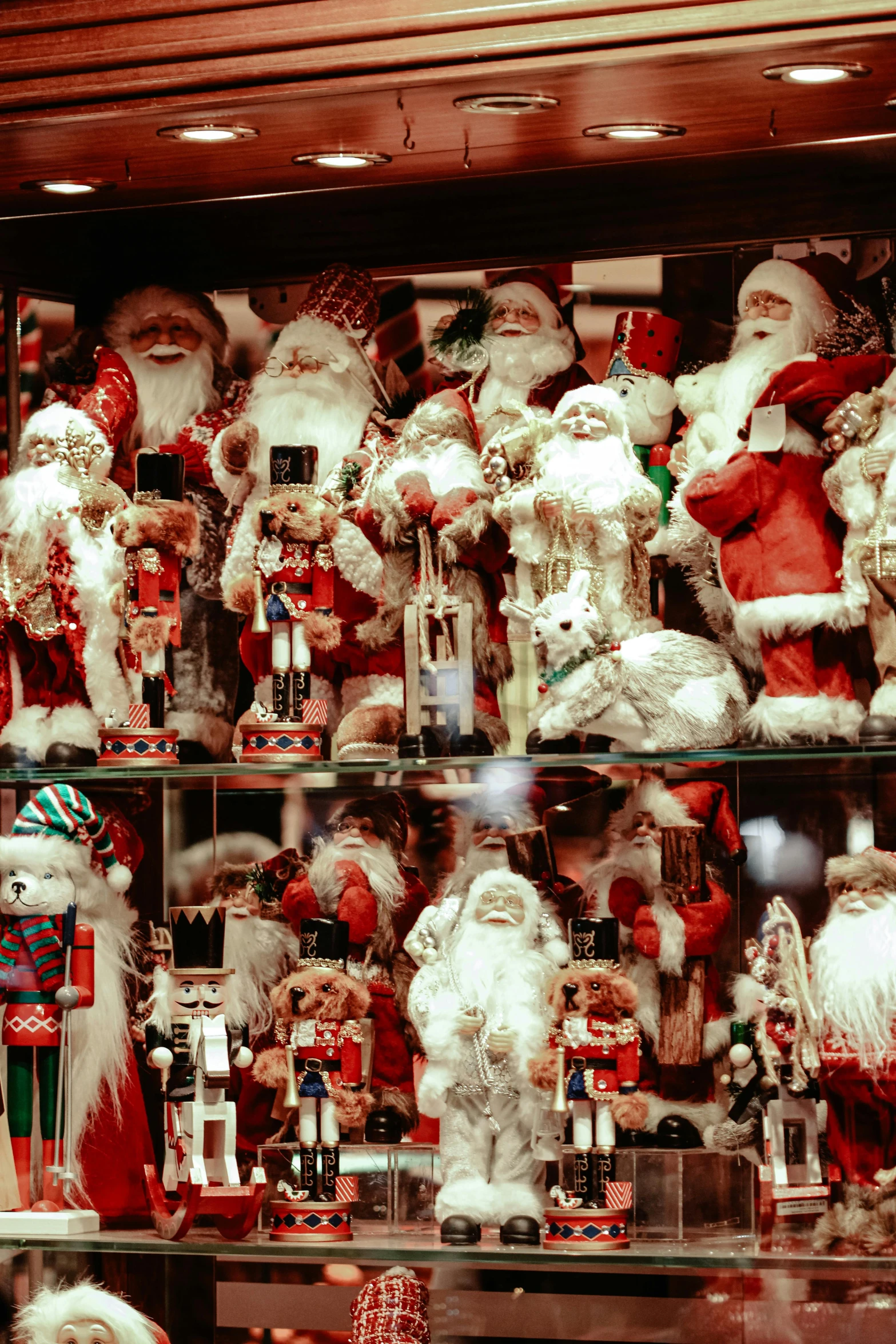 a very large assortment of santa clause decorations
