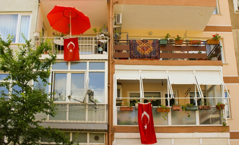 the balcony on an apartment building features multiple balconies and several balconies