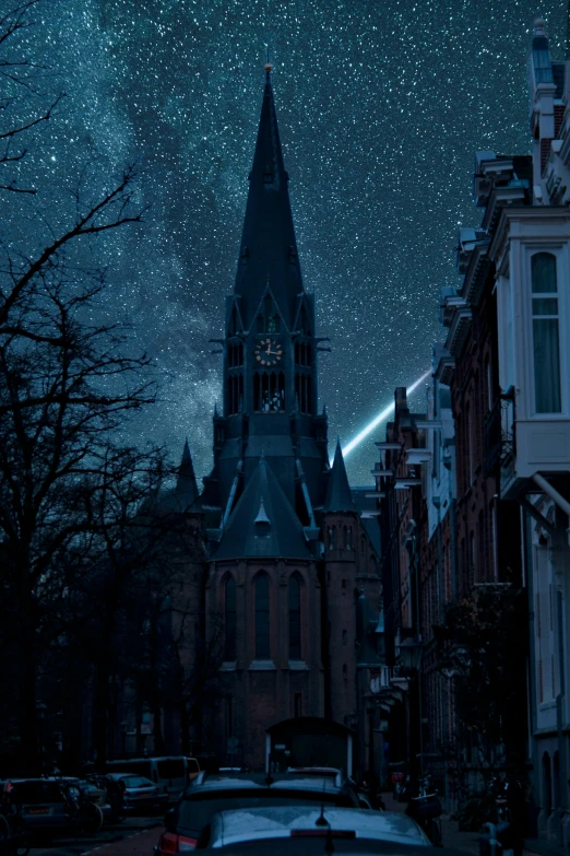 night view of city buildings with starry skies and clock tower