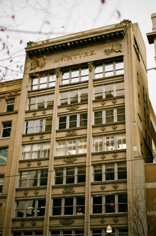 an abandoned building with glass windows on top