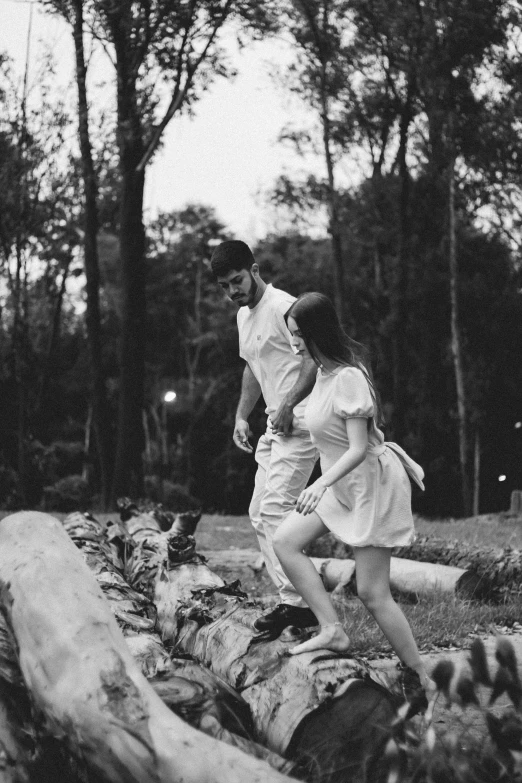 two girls are playing around with a frisbee