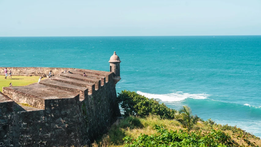 there are several towers at the edge of the sea