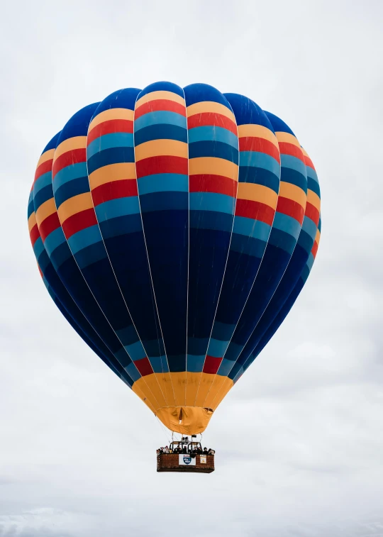 a large blue and orange  air balloon